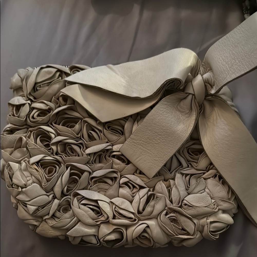 Miss Albright Philadelphia - Rose Leather clutch with bow.